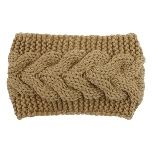 Detail of camel cable knit headband showing thick textured wool and braided pattern