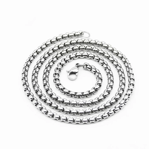 Minimalist silver stainless steel box chain necklace with lobster clasp on white background