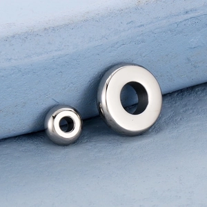 Detailed macro shot of different sized 18K gold plated stainless steel spacer beads