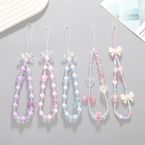 Set of five colorful beaded phone straps with acrylic charms and bow ties in diverse styles