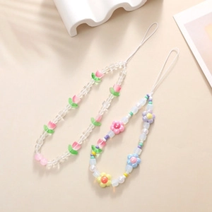 Detailed view of handmade beaded phone straps with colorful tulip and flower beads
