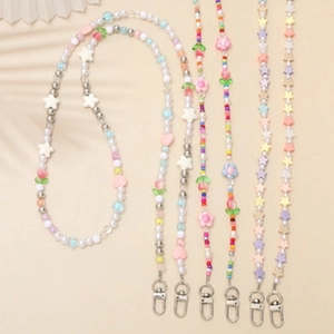 Detail of colorful candy-colored beaded lanyards with heart, star, and flower shapes
