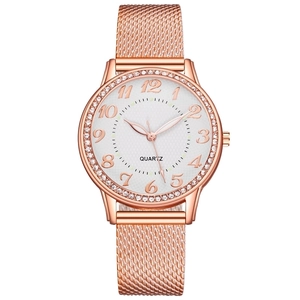 Detail of rose gold mesh strap and crystal-encrusted bezel on women quartz watch