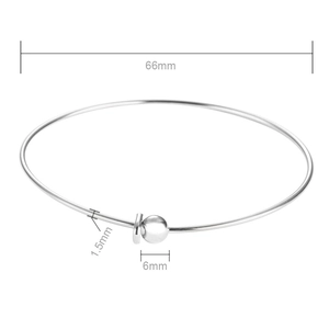 Polished stainless steel bangle with dimensions: 66mm diameter and 1.5mm wire thickness