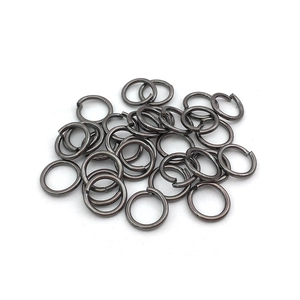 Pile of gunmetal open jump rings for DIY jewelry making and metal connector crafts