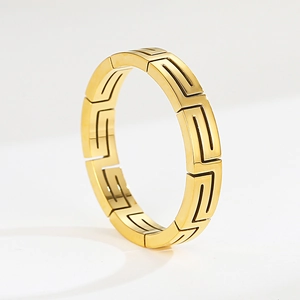 Polished gold titanium steel cuff bracelet featuring a hollow Greek key pattern design