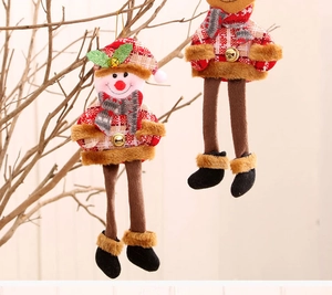 Detail of plush Christmas snowman ornament with long legs and gold bell decoration