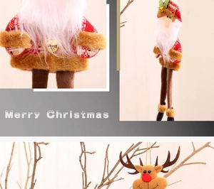 Detail of plush Christmas tree ornaments featuring long-legged Santa and reindeer dolls