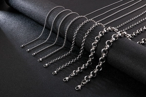 Close-up of various stainless steel Rolo and O-link chain necklaces in multiple sizes