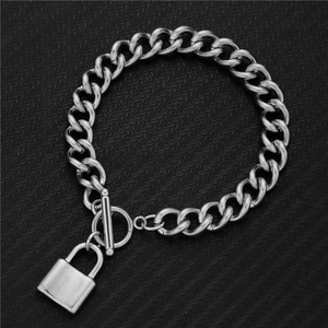 Detail shot of heavy stainless steel chain bracelet with OT toggle and padlock charm