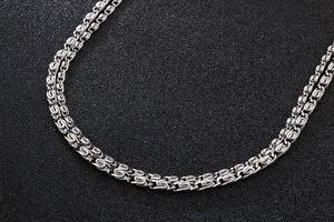 Macro shot of 304 stainless steel double row interwoven chain link with silver finish
