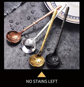 Detail of round stainless steel spoons in gold, rose gold, silver, and black finish