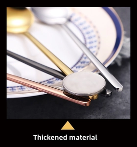 Macro shot showing the thickened material and polished edge of gold stainless steel spoons
