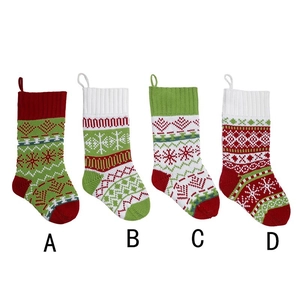 Set of four knitted Christmas stockings with festive patterns in red, white and green