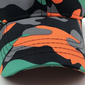 Close-up of orange camouflage baseball cap showing detailed stitching and fabric texture
