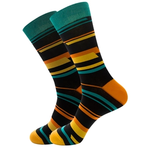 Detail of black mid-calf socks with colorful teal, orange and yellow striped pattern