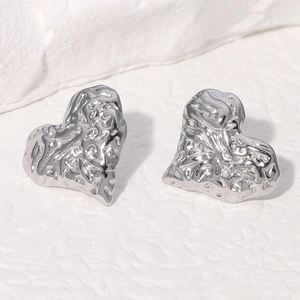 Lava style heart earrings in silver stainless steel with textured molten metal finish