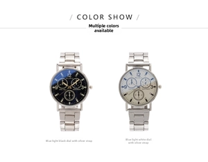 Close-up of men's steel chronograph watches with black and silver dials showing blue light mirror