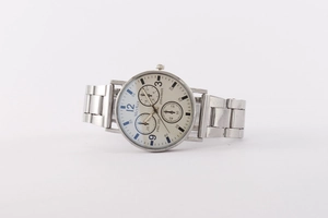 Close-up of MeyKey chronograph watch with silver metal band and white dial detail