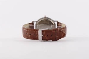 Detailed view of the brown leather strap and silver buckle of this men's quartz watch