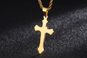 Detailed view of a gold stainless steel cross pendant featuring a twisted rope chain necklace