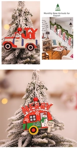 Detail of wooden Christmas tree ornaments with festive truck designs and red beads
