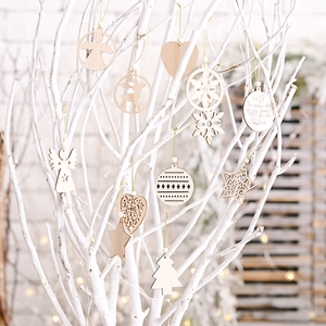 Wooden Christmas tree ornaments set with reindeer and snowflake in a warm festive scene