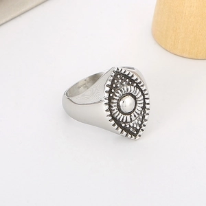Macro shot of S316L stainless steel ring showing vintage eye relief and material engraving