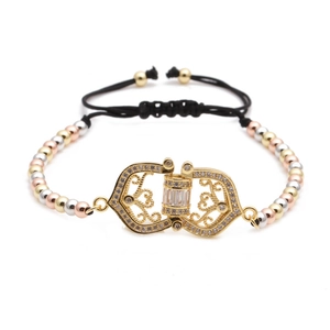 Detailed view of adjustable tricolor metal bead bracelet with cubic zirconia hollow charm