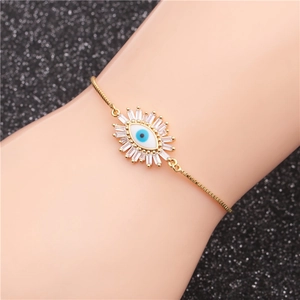 Adjustable evil eye bracelet with white zircon pave, shown on a model against black background