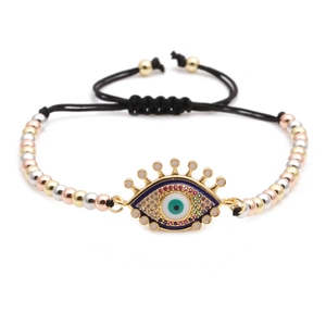 Detail of adjustable evil eye bracelet with tri-color beads and micro-set cubic zirconia