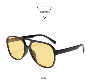 Side view of retro aviator sunglasses with black double-bridge frame and tea lenses