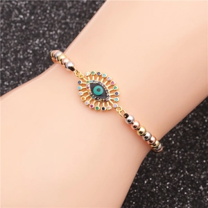 Adjustable evil eye charm bracelet with colorful zircon and mixed gold beads on wrist