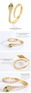 Macro details of S925 sterling silver snake ring with green zircon eyes and white stones