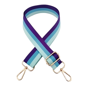 Adjustable rainbow bag strap with purple and blue stripes and golden metal clasps