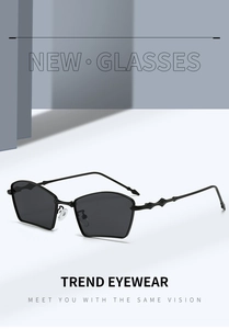 Detail of stylish wavy textured metal arms and dark gray lenses on geometric sunglasses