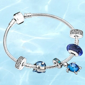 Silver snake chain ocean bracelet with sea turtle charm and blue glass beads