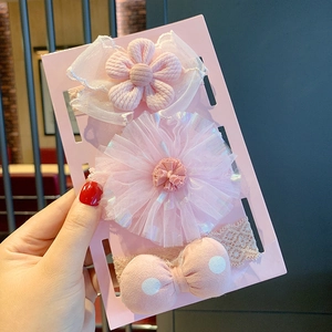 Detailed view of pink baby headband set featuring floral lace and bow designs for toddlers