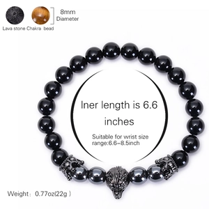 Beaded bracelet with tiger eye, lava stone, hematite, and a crown wolf head charm