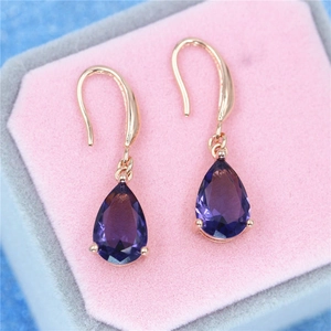 Elegant rose gold drop earrings with pear-cut purple amethyst stones in a pink velvet box