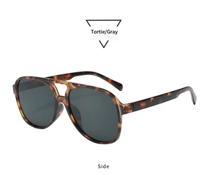 Side view of retro oversized tortoiseshell aviator sunglasses with gray lenses
