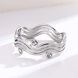 Elegant wave-shaped stainless steel ring featuring three sparkling inlaid zircon accents