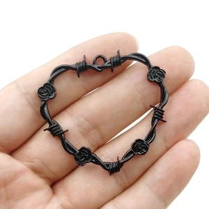 Gothic heart pendant with thorny wire and rose details in antique silver finish