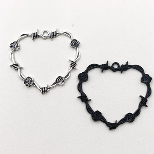Antique silver and black heart charms with thorn wire design and rose flower accents