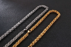 Detail of silver and gold Byzantine chain necklaces with secure lobster clasps