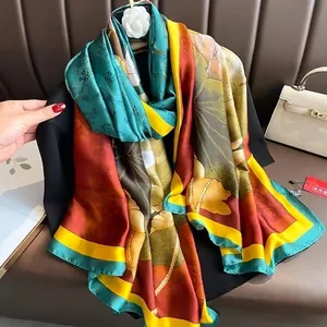 Silk-like fashion scarf with lotus and butterfly digital print in peacock green and orange