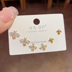 Three-piece gold zircon bee earring set with S925 silver needles shown on a jewelry card