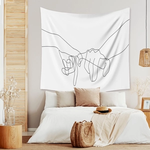 Detail view of a minimalist line art tapestry showing pinky swear hands on a bedroom wall