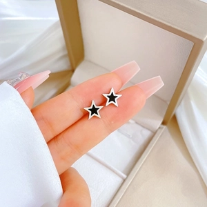 Titanium steel pentagram stud earrings with black and white star design for women