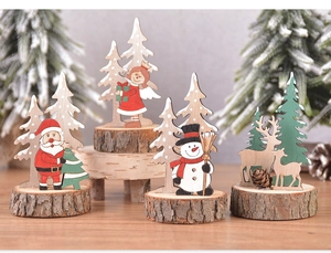 Detail of wooden Christmas tabletop ornaments featuring Santa, Angel and Reindeer designs
